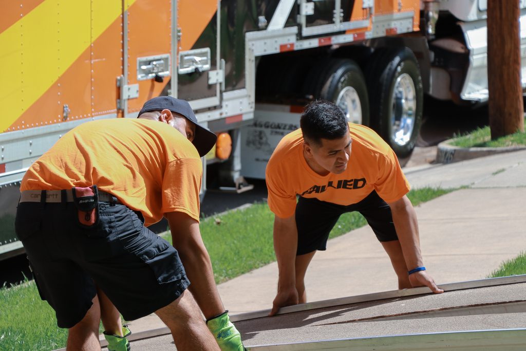 Allied Movers lifting a ramp